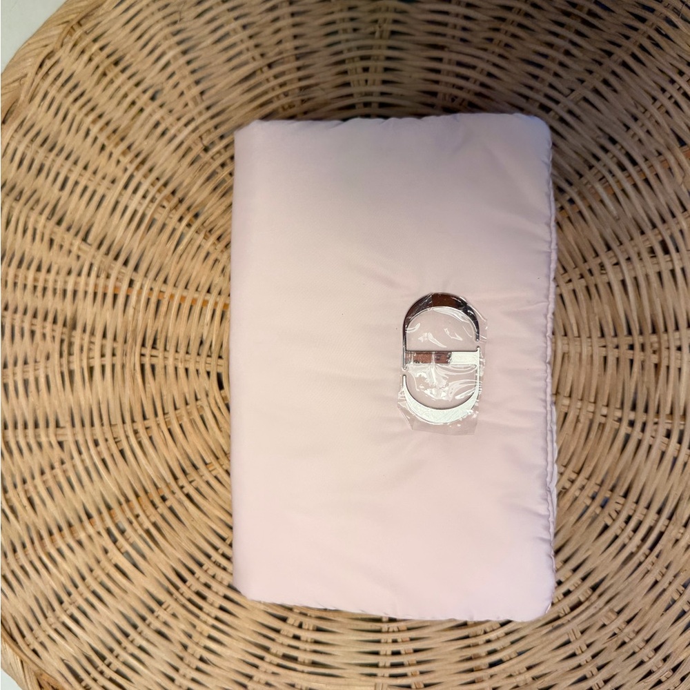 DIOR makeup puffer pouch. Pink Foldover Clutch with Shiny Silver initials.